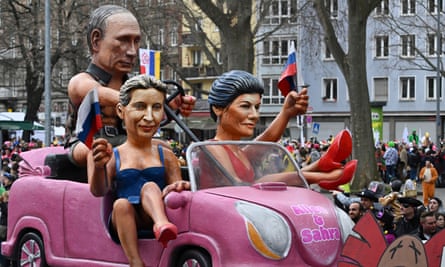 A float depicting ‘Barbies and Ken’ – Russian president Vladimir Putin (left), AfD leader Alice Weidel (centre) and Sahra Wagenknecht, leader of the leftwing BSW party – at the Rose Monday parade in Mainz, Germany, in February