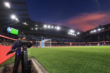 A camera operator at Etihad Stadium in 2023.