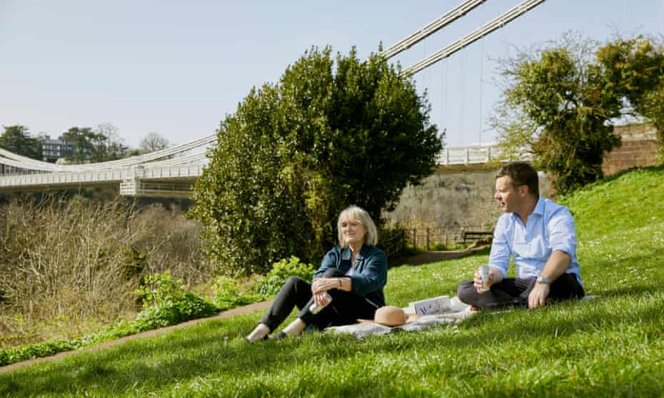 Fiona Beckett, left, enjoying a socially distanced canned drink with a friend in Bristol.