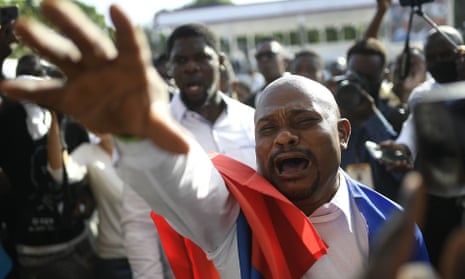 A man reaches out in grief at the funeral of Haiti’s President Jovenel Moïse on Friday.