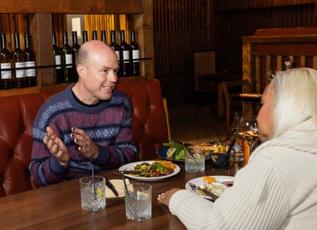 Fred and Maxine chatting across a restaurant table