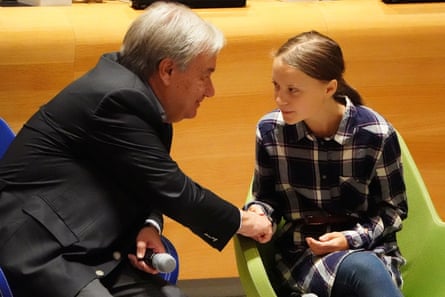 Guterres greets the Swedish environmental activist Greta Thunberg at a youth climate summit at the UN headquarters, New York, in September 2019.