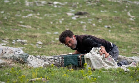 Ecologist Christophe Bonenfant with a cage