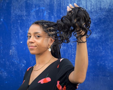 Micha Frazer-Carroll shows off her newly done braids.