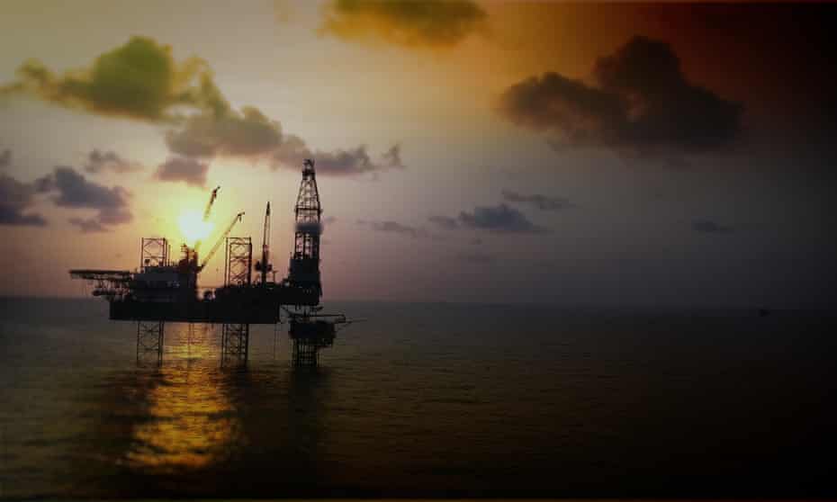 Aerial view of offshore jackup drilling rig during sunset