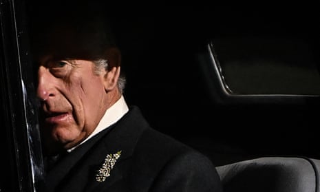 King Charles III reacts as he leaves at the end of a vigil at St Giles' Cathedral, in Edinburgh on Monday.