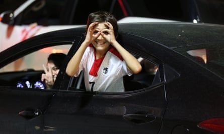 A fan in Tbilisi mimics Georges Mikautadze’s goal celebration as joyous supporters take to the streets to celebrate their team’s qualification for the last 16 at Euro 2024.
