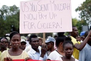 Haitian protesters call on the US to pay for the cholera outbreak caused by Minustah, the UN peacekeeping mission in Haiti