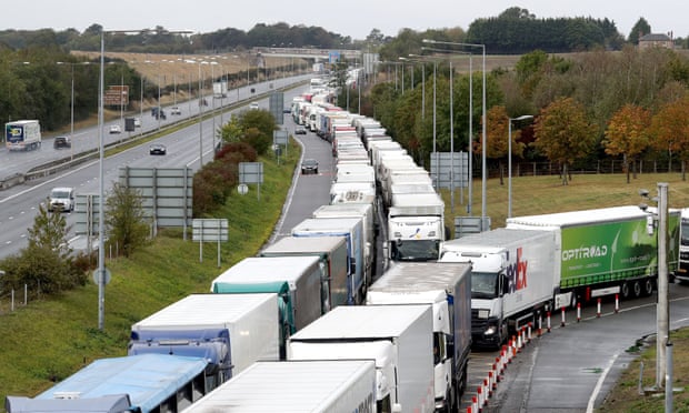 Lorries queue on the M20 for the Eurotunnel in Folkestone, Kent, as a 27-acre site near Ashford is developed into a post-Brexit lorry park, 25 September 2020.