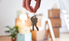 Close-up of woman holding house key in new home