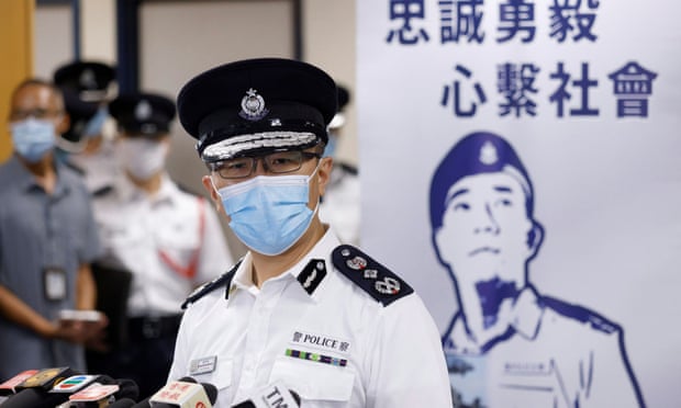 Police chief Raymond Siu speaks in front of a banner with the police force’s motto ‘Serving Hong Kong with Honour, Duty and Loyalty’