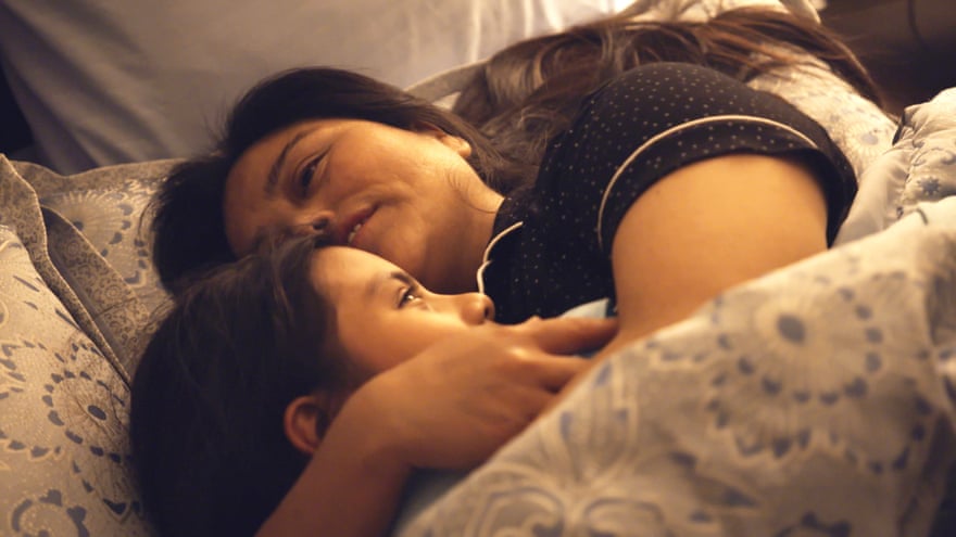 Vilma and her daughter Yeisvi reunited and cuddling in their bed in Torn Apart