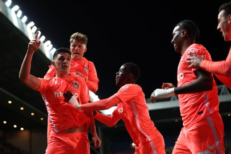 Bobby Thomas’ Coventry City teammates celebrate with him after he headed home their equaliser.