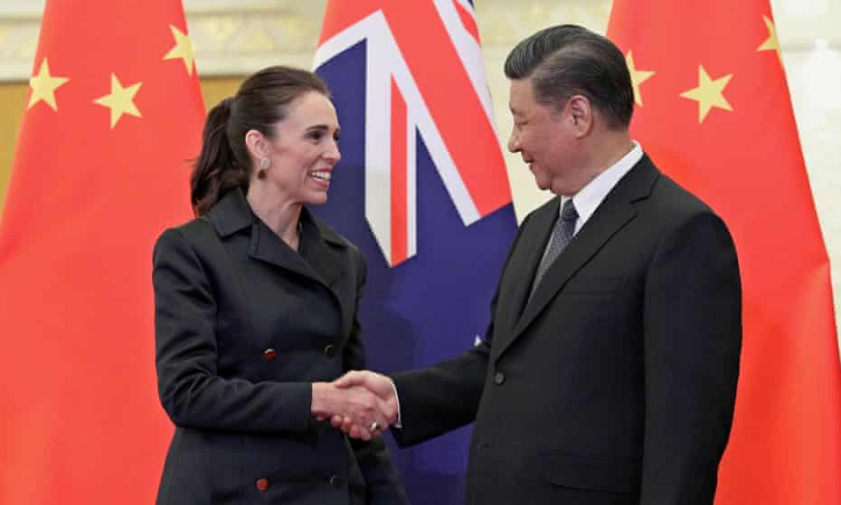 New Zealand prime minister Jacinda Ardern (left) shakes hands with Chinese president Xi Jinping.