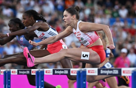 Pia Skrzyszowska clears a hurdle during her women's 100m hurdles semi-final.