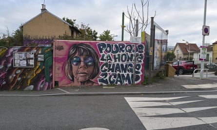 A mural showing Gisèle Pelicot’s face and the words ‘So that shame changes side’ in French