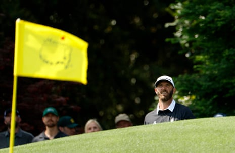 Dustin Johnson watches his chip onto the 8th green.