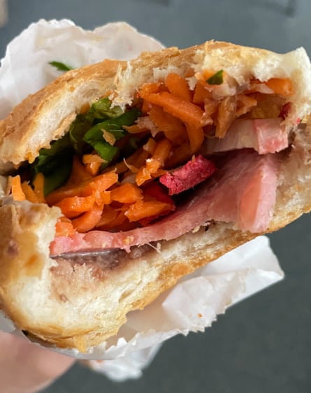 Grated veg and meat slices appealingly wrapped in a flatbread