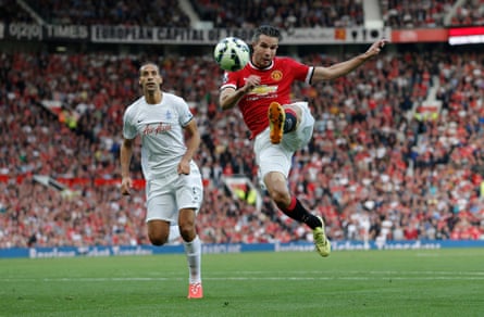 Robin van Persie shoots an acrobatic volley during Manchester United’s Premier League match against QPR in September 2014