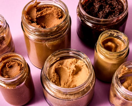 Several opened jars of miso paste.