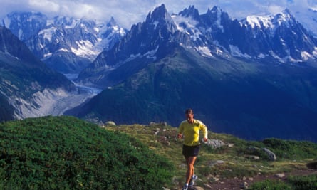 A woman trail-runs in the mountains above Chamonix, France.