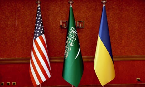 The flag of Saudi Arabia is seen in the middle between the USA and Ukraine flags prior to talks.