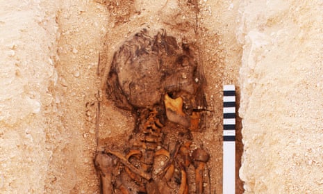 A juvenile burial under excavation at the North Tombs Cemetery, Amarna, Egypt