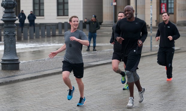 Mark Zuckerberg out running with Ime Archibong (Facebook’s vice-president of product partnerships) and bodyguards in Berlin in 2016. Personal security topped his 2018 security costs.