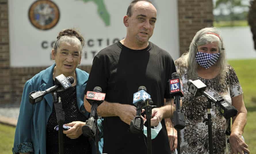 Robert DuBoise, 55, meets reporters with his sister Harriet, left, and mother Myra, outside the Hardee county correctional institute after his release on 27 August in Hardee county, Florida.