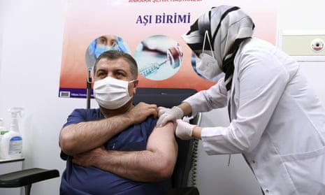 Turkey’s health minister Fahrettin Koca receives the first jab after Turkish authorities gave the go-ahead for the emergency use of the Covid-19 vaccine produced by China’s Sinovac