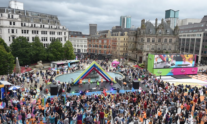 Mr Motivator conducts a free public workout in Victoria Square whilst the beach volleyball is shown on a big screen next to the stage on day two.
