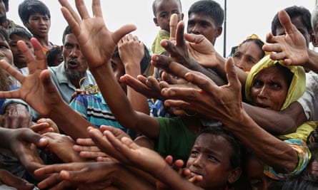 Hungry Rohingya refugees wait for food at the Kutupalong border camp in Bangladesh.