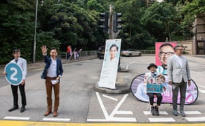 Candidates Arthur Yeung (blue jacket) and Tse Wai Chun Paul canvassing for votes in Broadwood district.