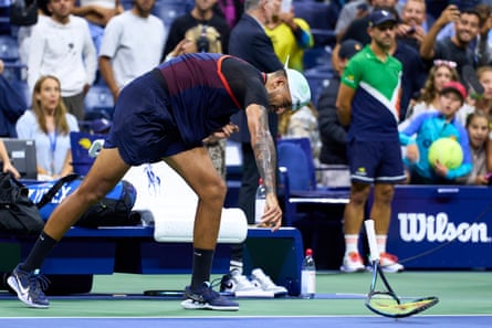 Kyrgios smashes a racket at the end of the match.
