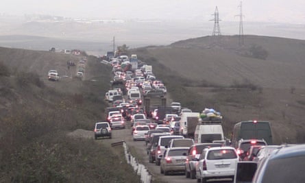 People fleeing Nagorno-Karabakh to Armenia on Saturday as Azerbaijani forces advanced into the enclave.