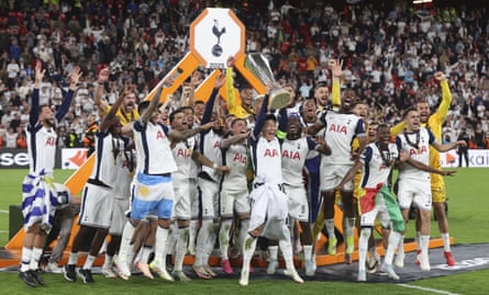 Son Heung-min lifts the Europa League trophy.