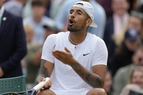 Kyrgios complains to the umpire about a line call after losing a point to Tsitsipas.