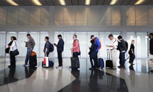 Passengers at O’Hare International airport in Chicago wait in line to be screened at a Transportation Security Administration (TSA) checkpoint.