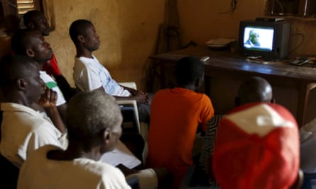 Ivorians watching the trial on television