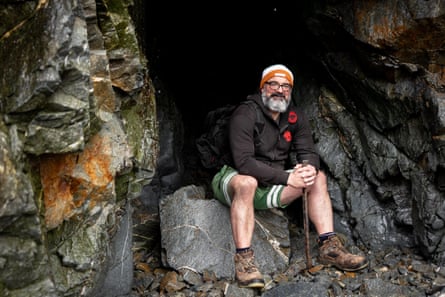 David Keohan sits at the mouth of a cave looking into space