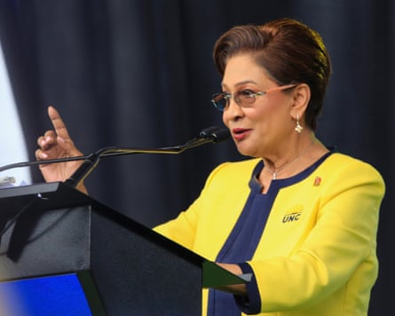 Persad-Bissessar speaks at podium during a United National Congress event in Couva, Trinidad and Tobago