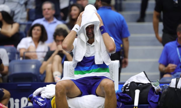 Novak Djokovic is overcome with emotion during the changeover before Daniil Medvedev served for the title.