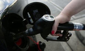 A car being filled with fuel