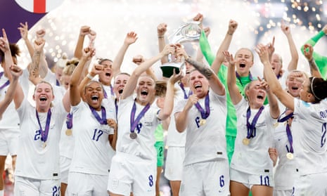 England’s players celebrate with the Euro 2022 trophy after their side's victory over Germany