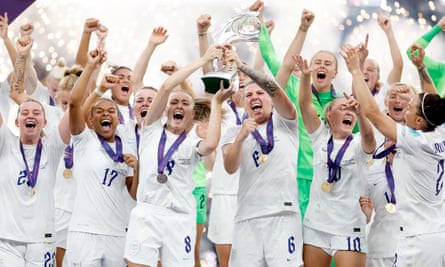 Wiegman’s players celebrate on the podium after winning the Euros
