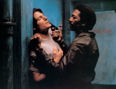 Freeman holds a gun to Christopher Reeve’s head in aa still from Street Smart