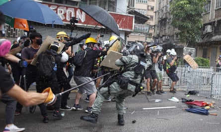 Protesters clash with police in Yuen Long district.