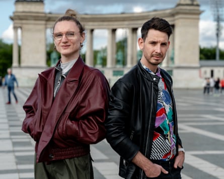 Lilla Hübsch and Ádám Kanicsár stand in a Budapest square.