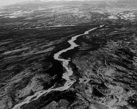 black and white overhead panorama of river, road and peaks