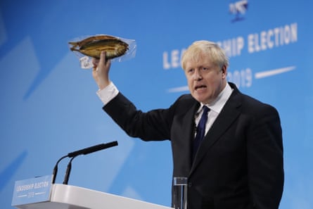 Boris Johnson holding up a kipper.